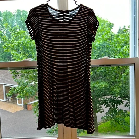 Black and white striped athletic dress. Light material, stretchy. Size M. Black and white striped athletic dress. Light material, stretchy. Size M.